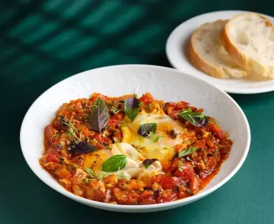 ICONIC Shakshuka with eggs in tomato sauce