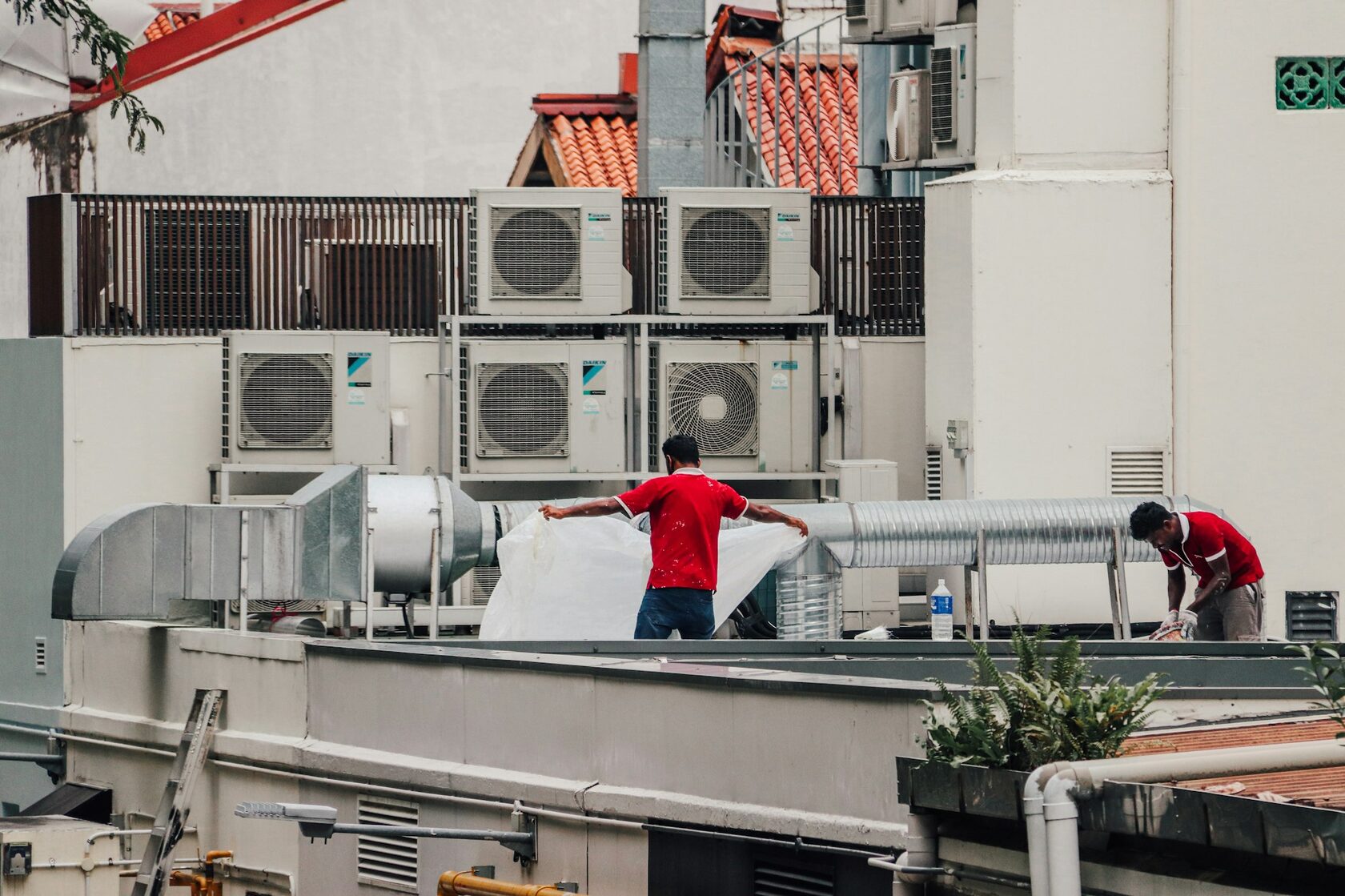 HVAC technician servicing an air conditioning unit
