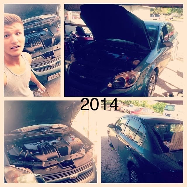 Two generations of the family working together on a car