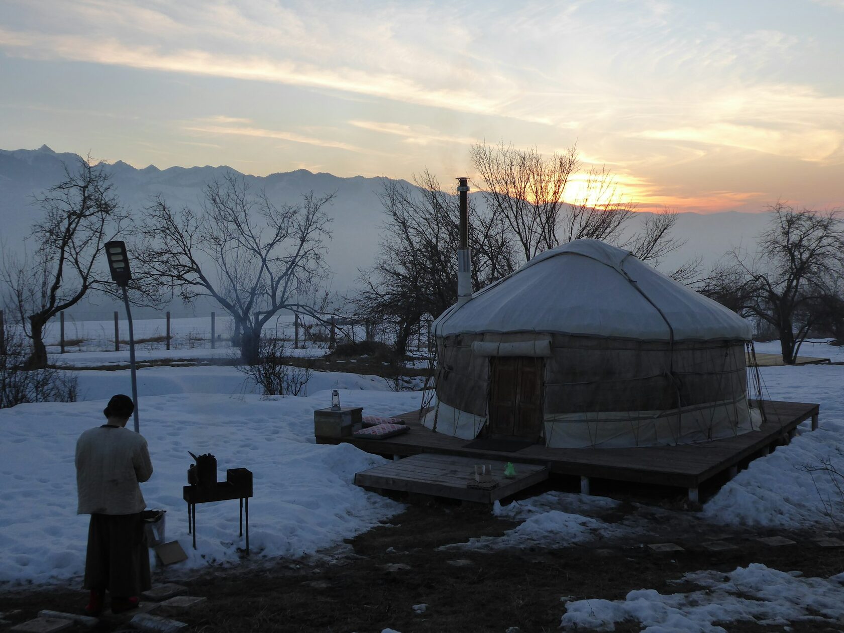 Traditional yurt camp in the mountains at dusk