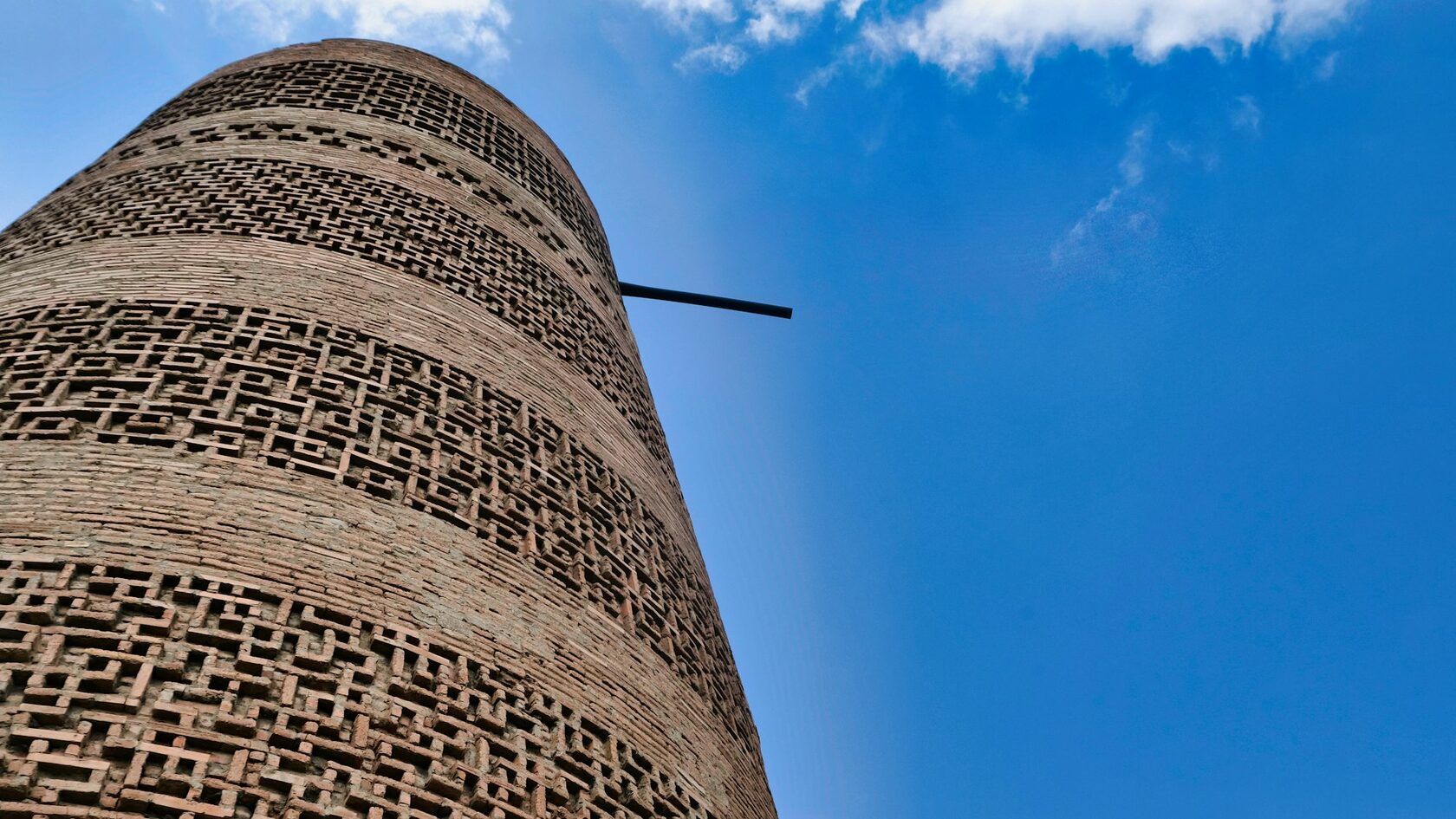 The historic Burana Tower on the Silk Road with the Tian Shan mountains behind it