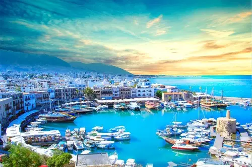 Scenic harbor of Kyrenia in Northern Cyprus — yachts, fortress, and turquoise Mediterranean Sea