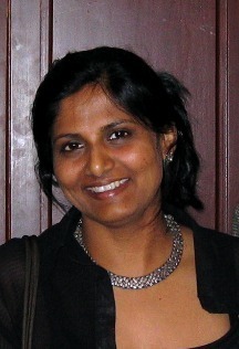 Portrait of Indian astrophysicist and Yale professor Priyamvada Natarajan, known for her pioneering research in dark matter, dark energy, and black holes.