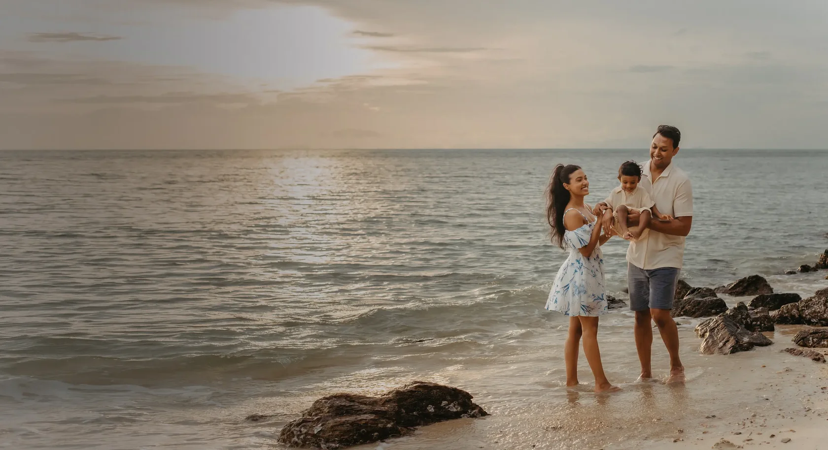 Professional family photographer in Koh Samui capturing a happy family moment for a high-end vacation portrait