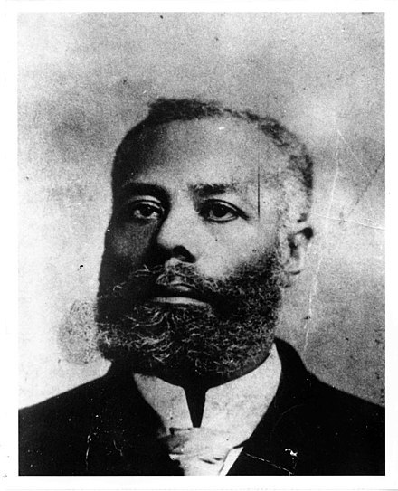 Black-and-white portrait of Elijah McCoy, a 19th-century Canadian-American engineer and inventor known for his work on steam engine lubrication systems.