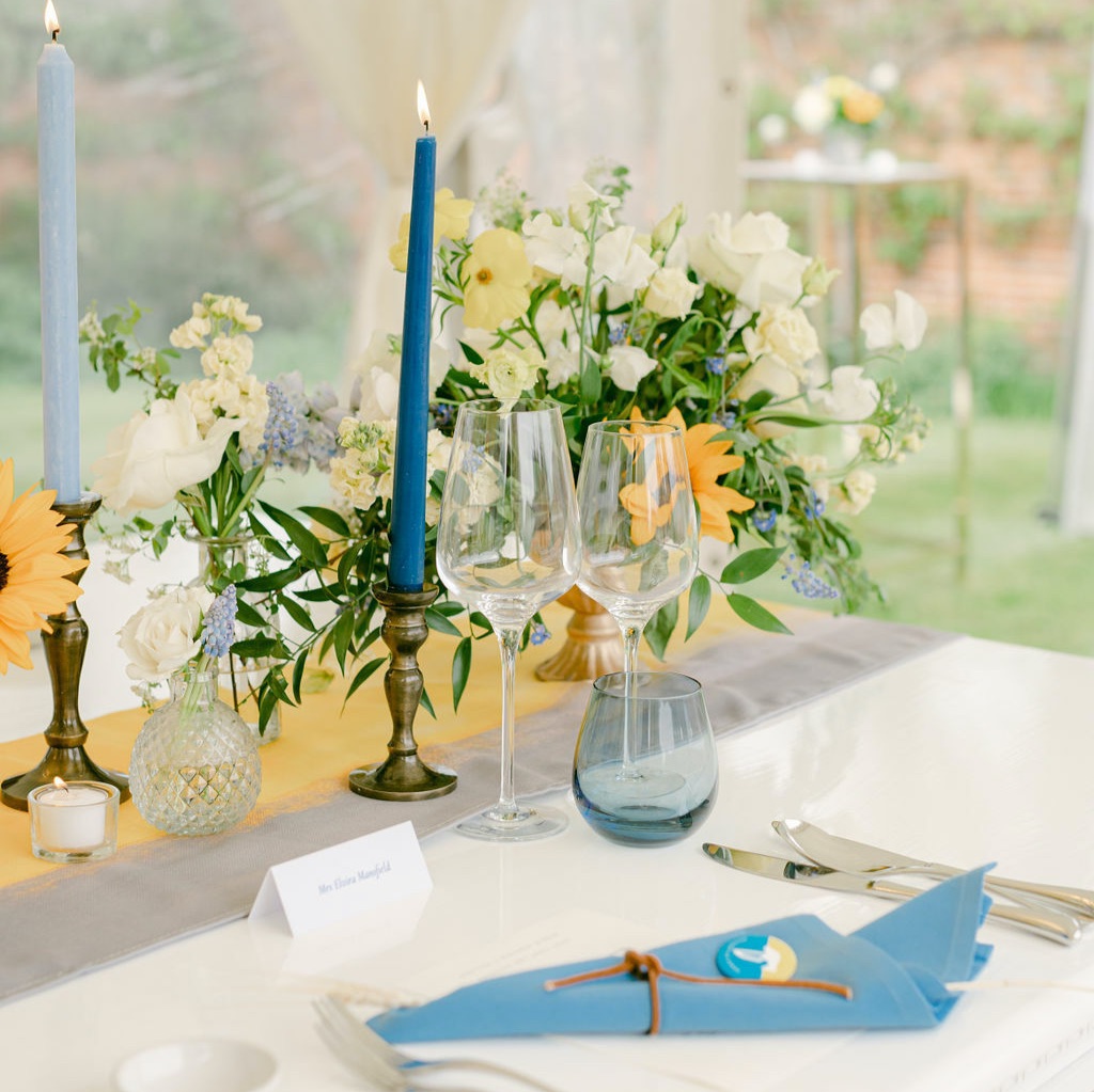 Circus artists perform on a grass in front of the white circus tent during the private family party