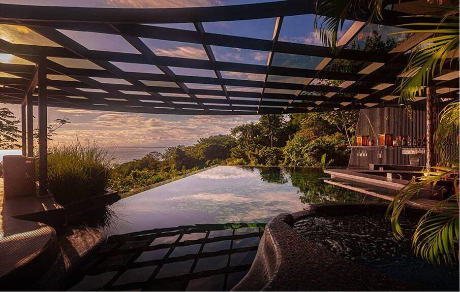 Cliffside infinity pool at the Ocean Club at dusk, the ocean beyond — Makanda