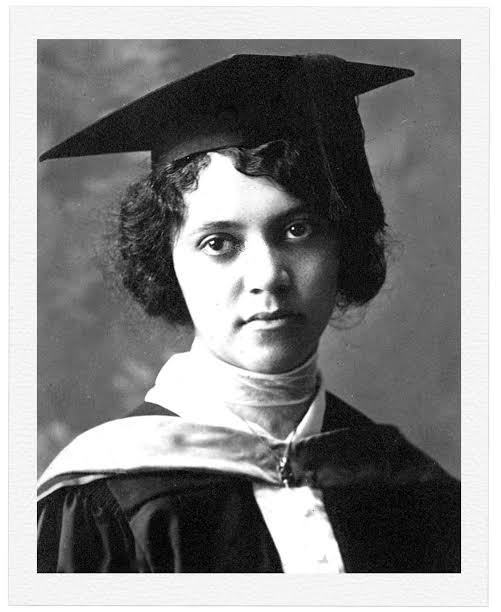 Historic black and white portrait of Alice Augusta Ball wearing academic graduation robes and a mortarboard cap, looking directly at the camera.