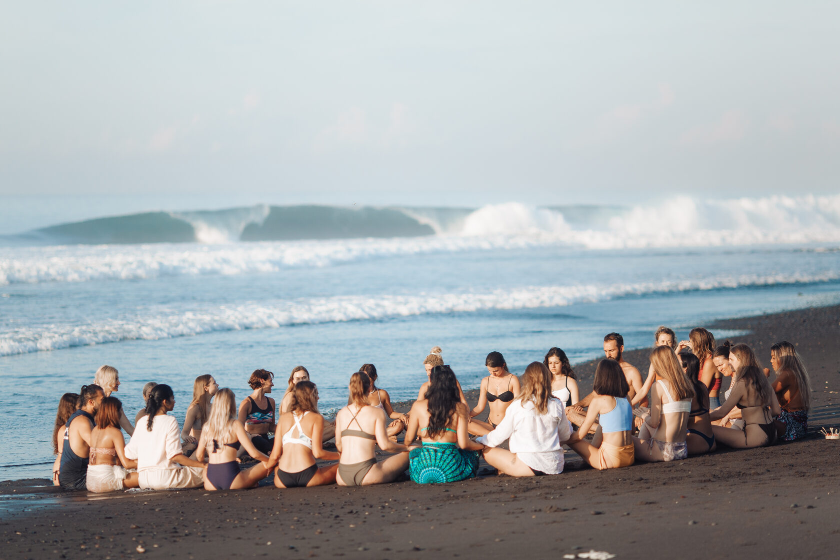 House of Om community circle on the beach