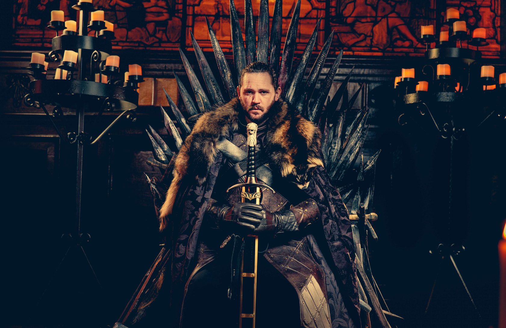 Jon Snow look alike at the Iron Throne at the Game of Thrones themed birthday party in Stationer's Hall, London