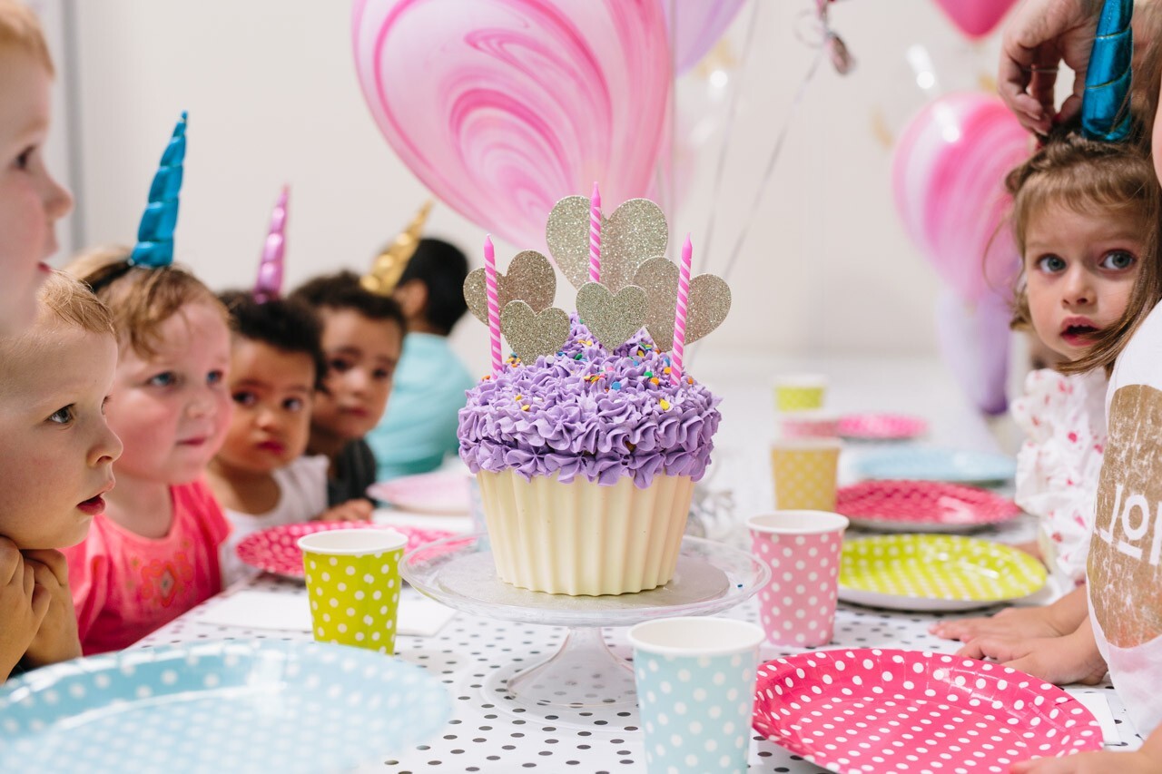 Children celebrating a birthday party at Tumbles Playhouse