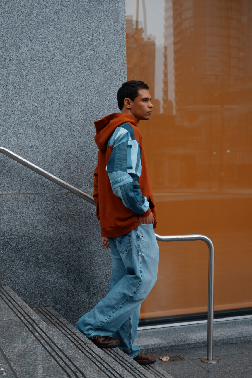 Male model in denim hoodie urban setting