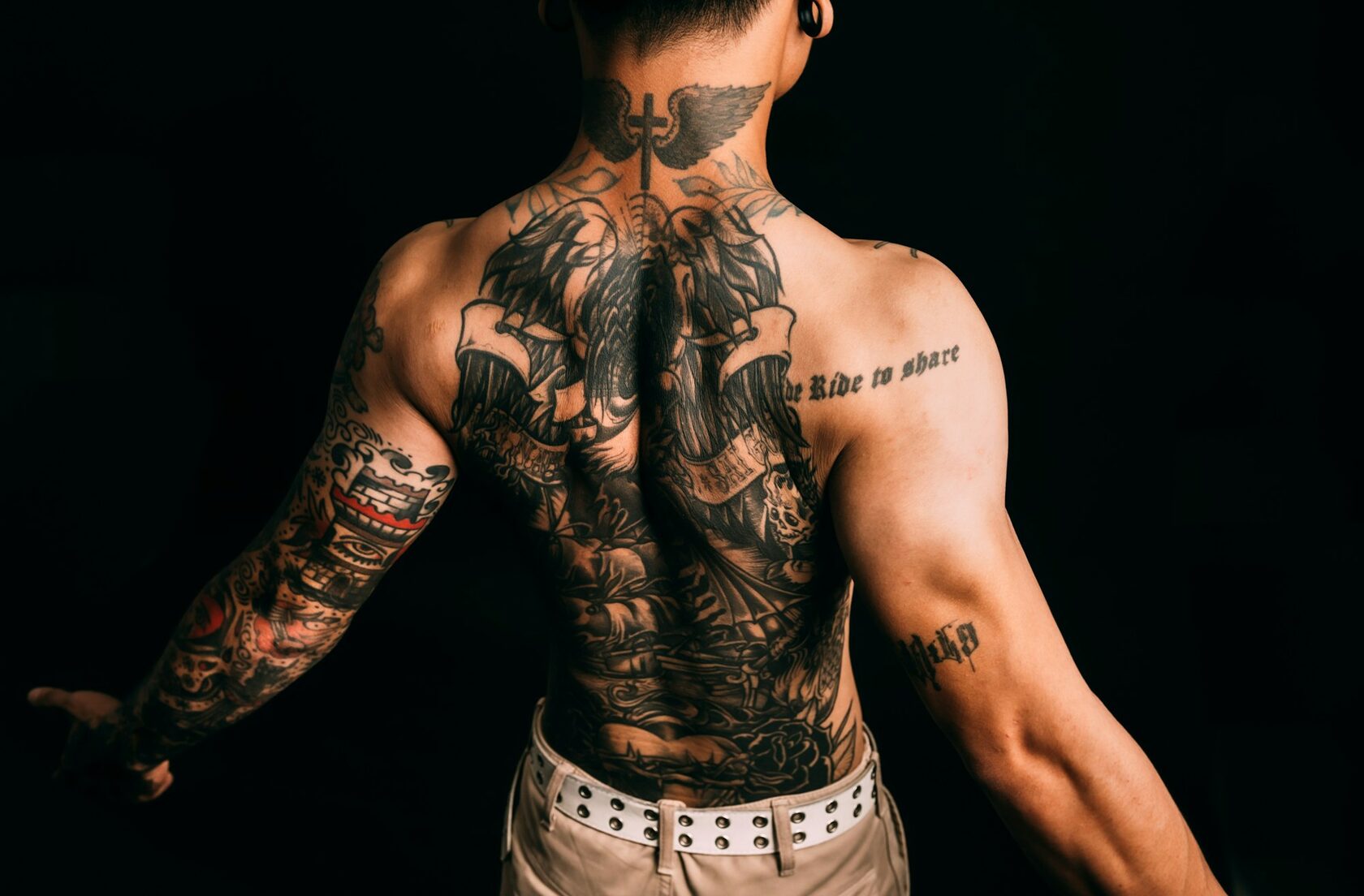 Stack of small minimalist tattoos on arm