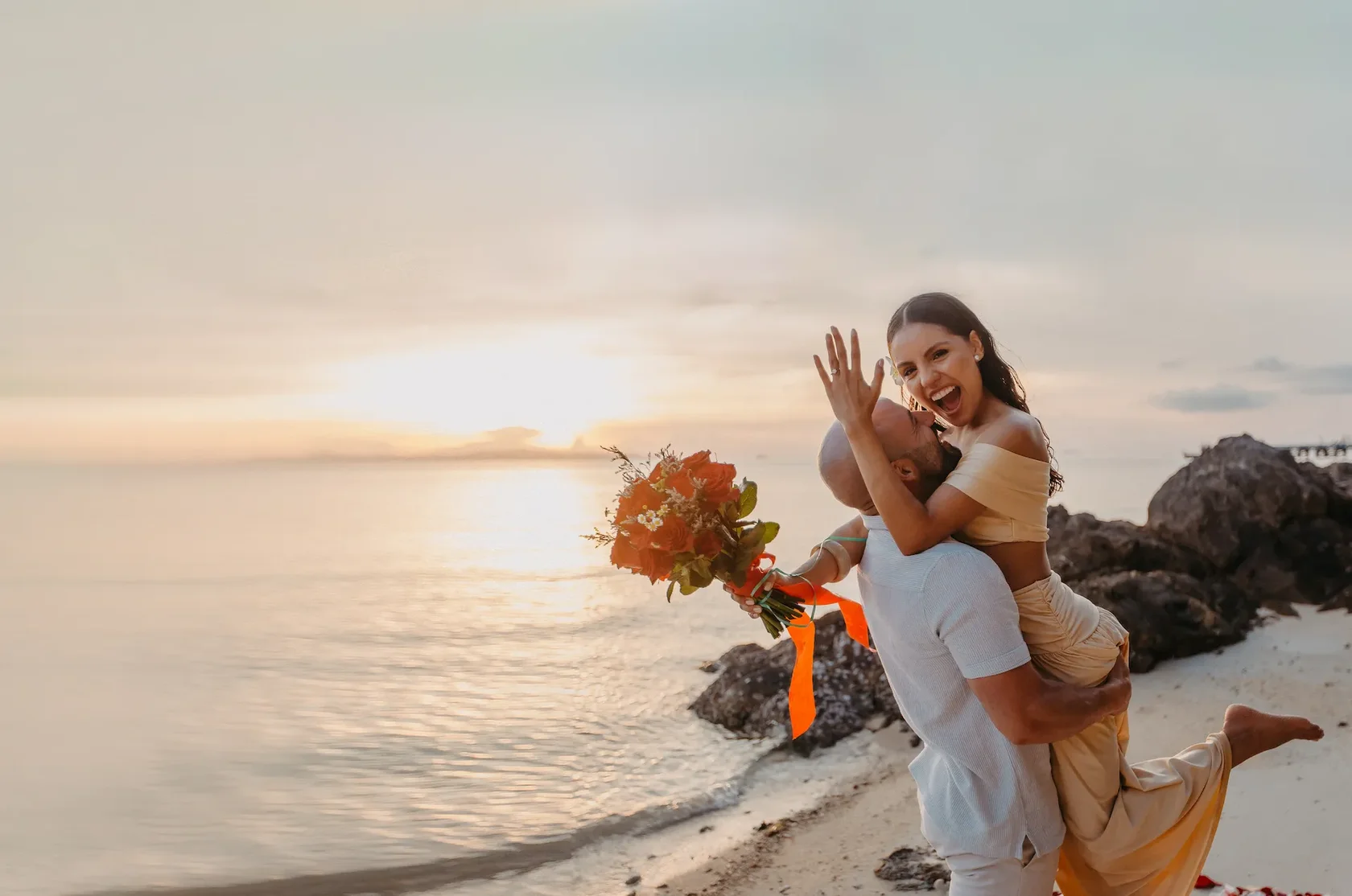 Professional surprise proposal photographer in Koh Samui capturing elegant couple moments on a scenic sunset beach