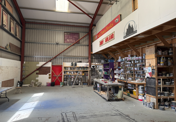 Props and materials neatly arranged on workshop shelving