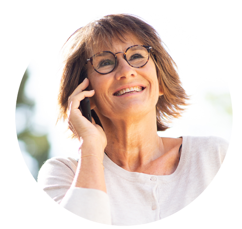 Woman smiling using mobile phone