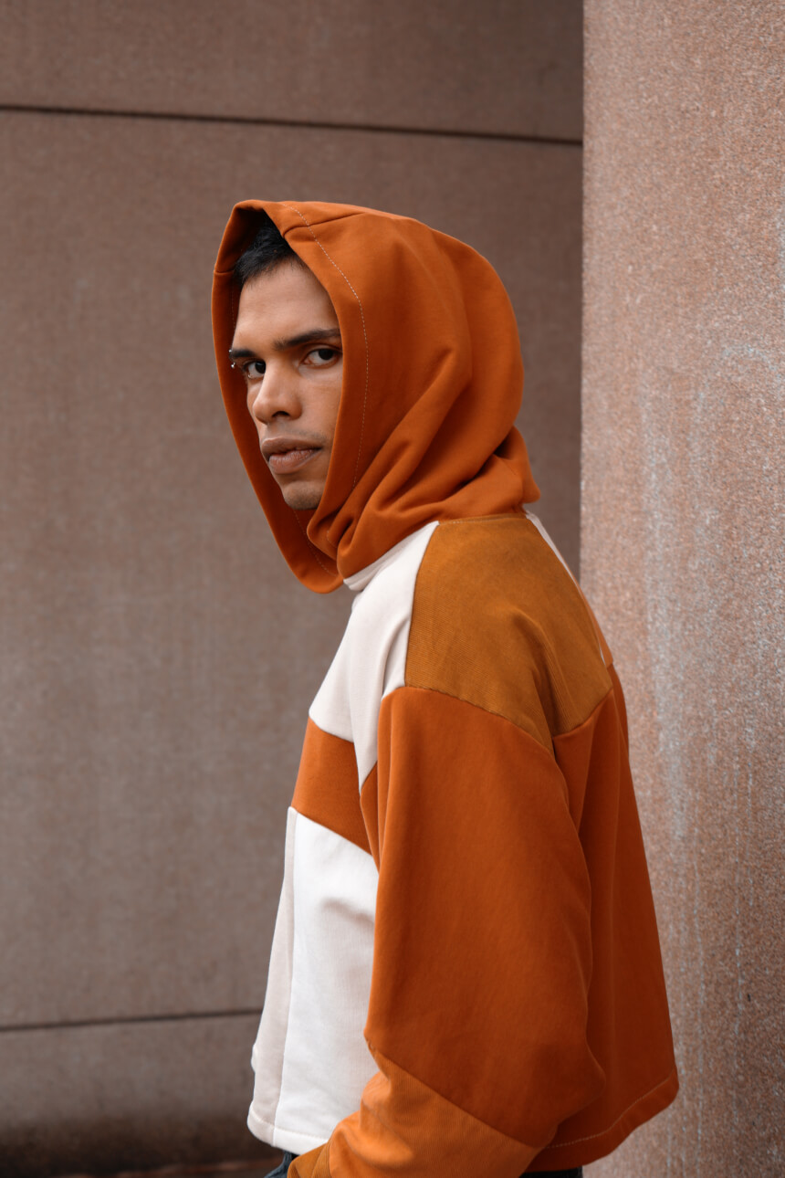 Male model in an orange hoodie