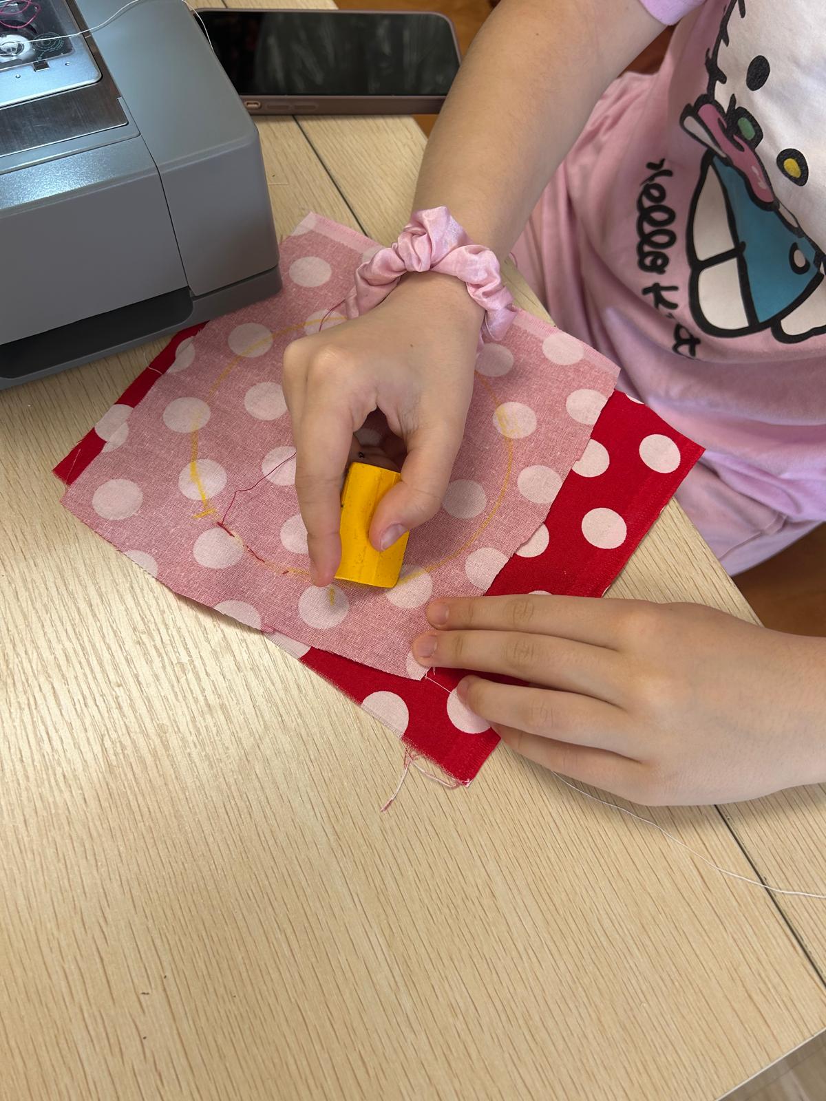 Kids learning hand-sewing basics