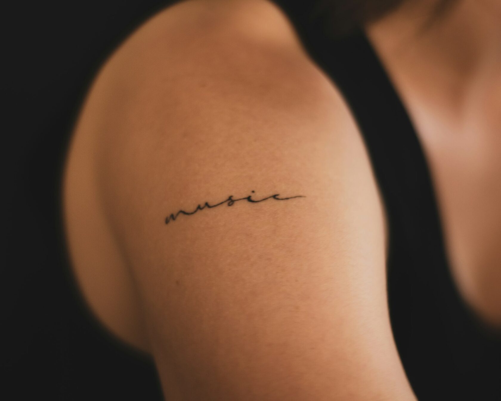 Fine lettering script tattoo