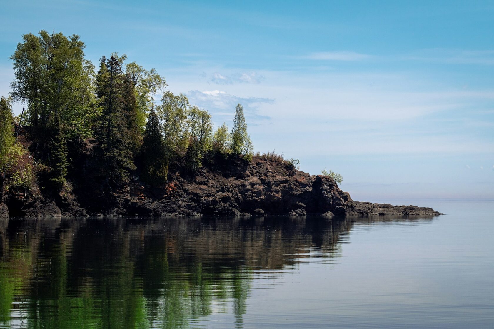 The blue waters and northern shore of Issyk-Kul lake in Kyrgyzstan
