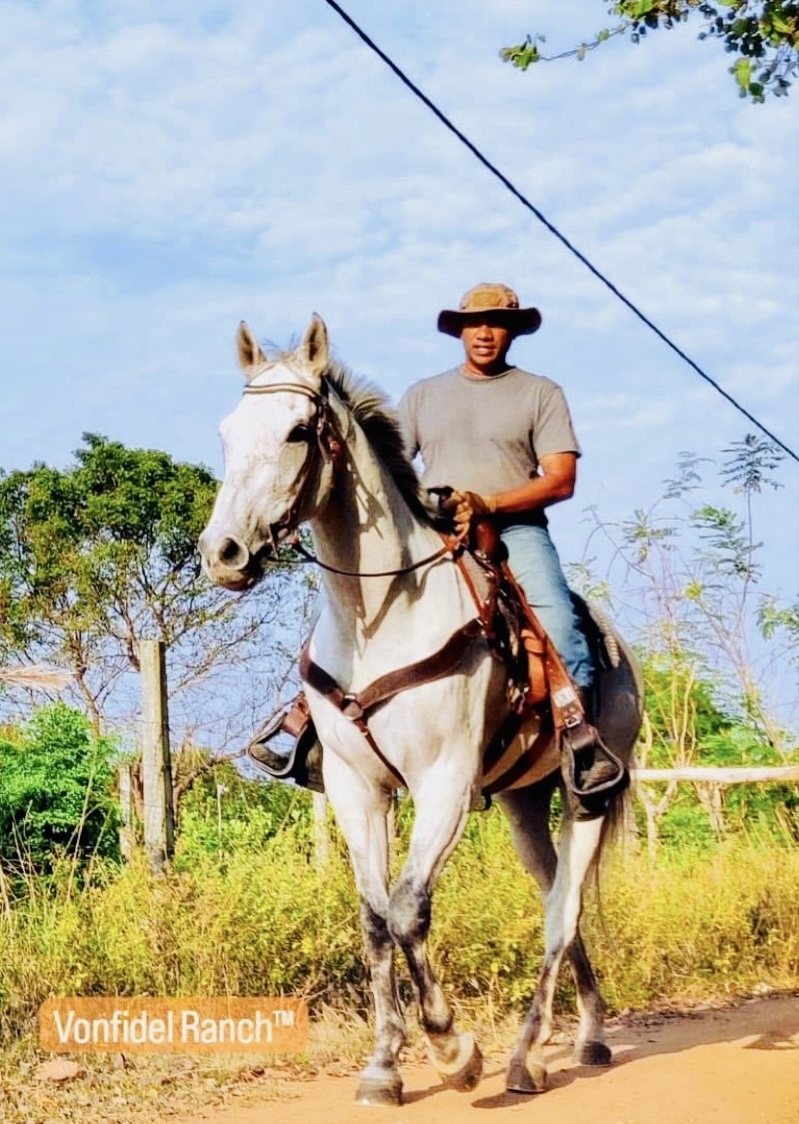 Founder of Vonfidel Ranch on horseback