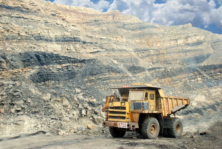 Rigid mining dump truck in an open-pit mine — Liebherr haul truck spare parts sourced by IWH from Turkey