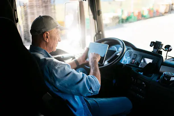 CDL-A driver in truck cabin