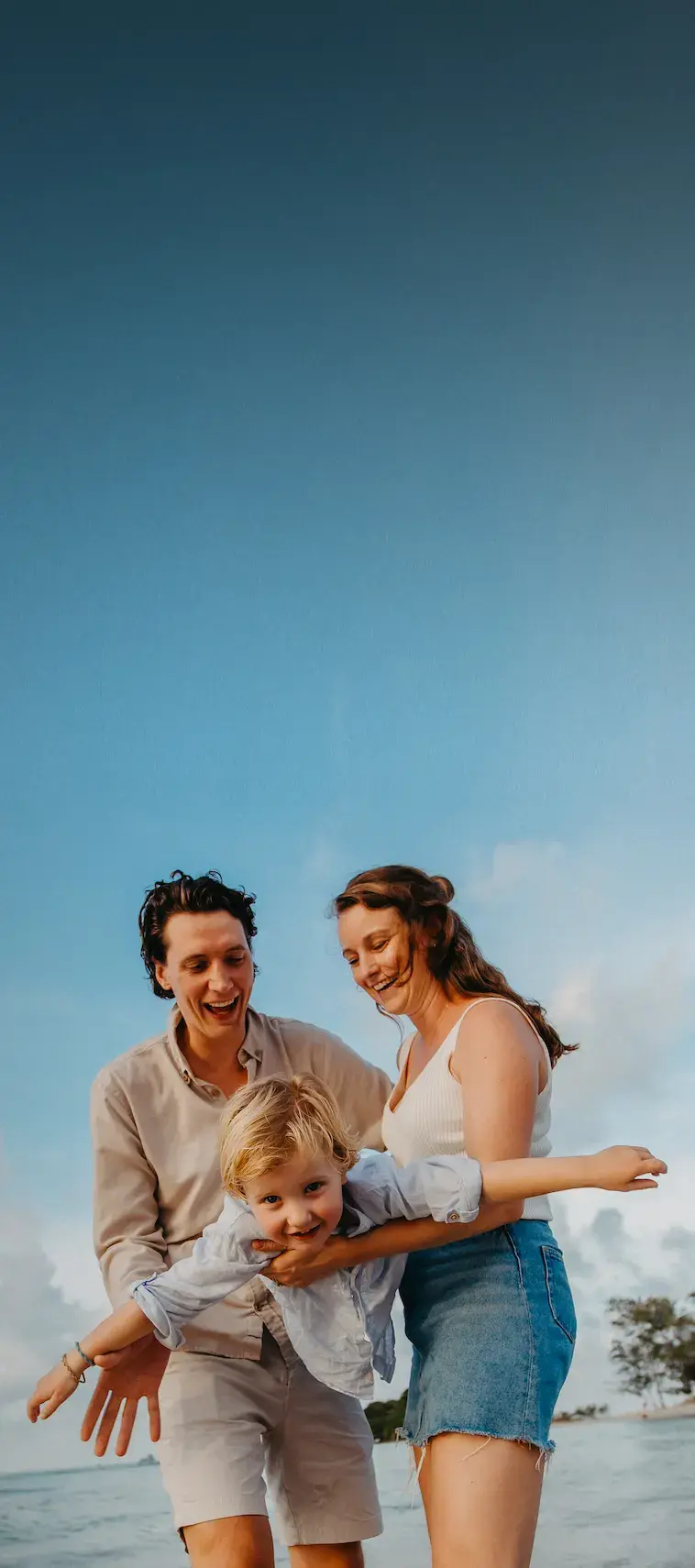 Happy family portraits at sunset beach in Koh Samui — lifestyle photography session