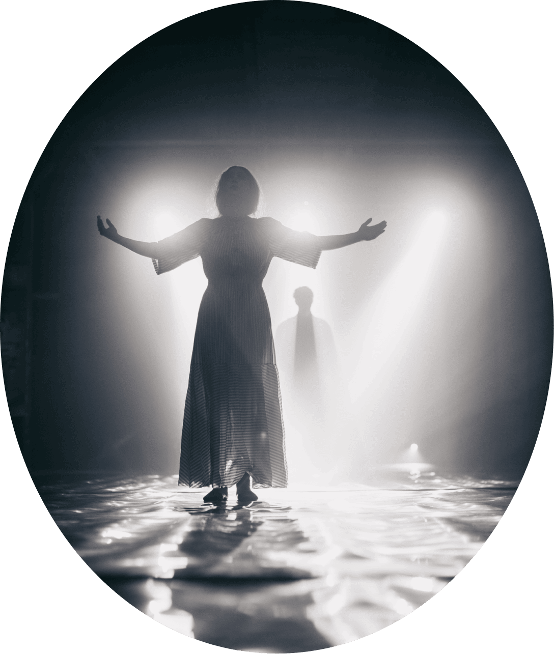  black and white photo of a girl standing on stage