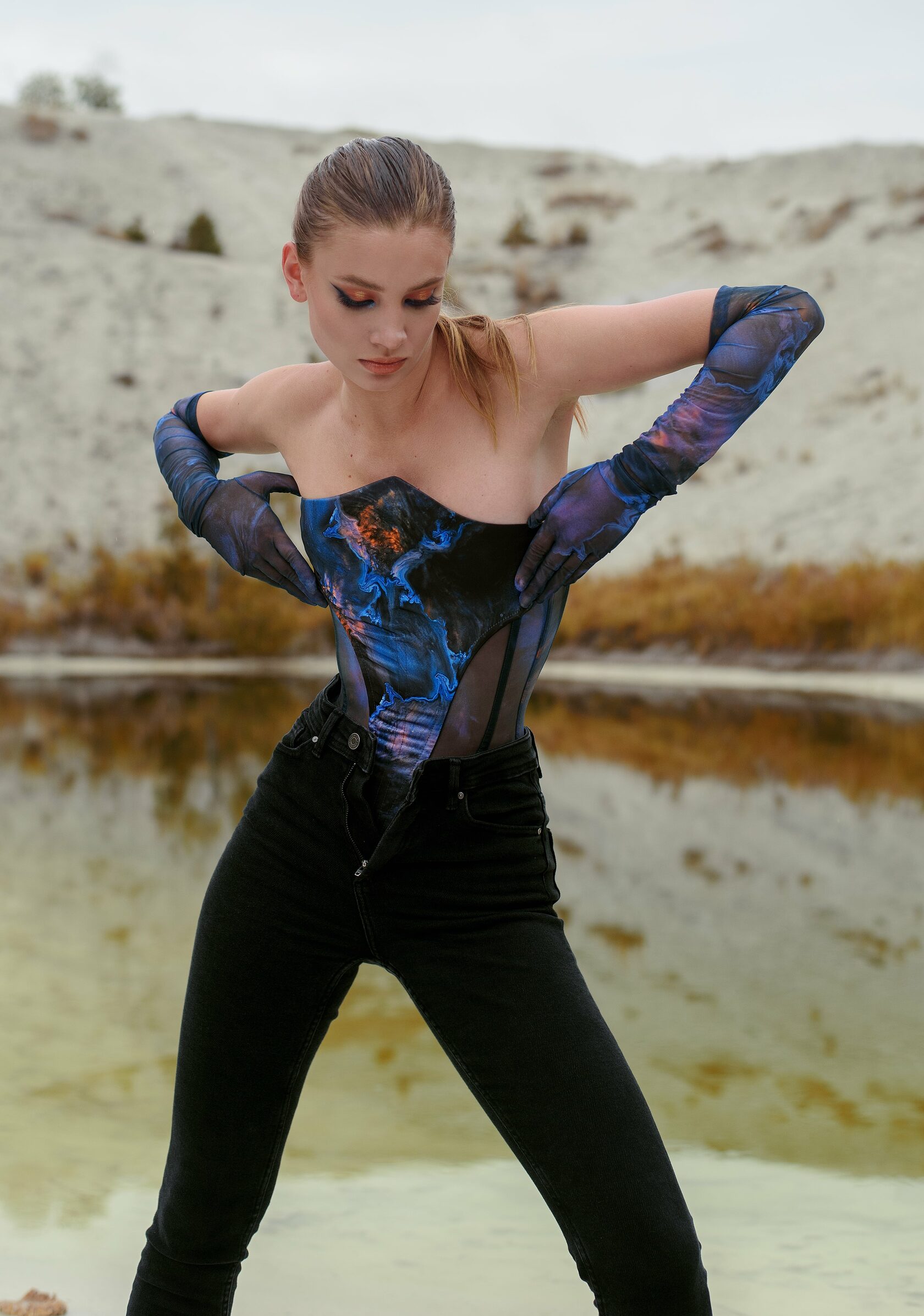 woman in blue corset and gloves