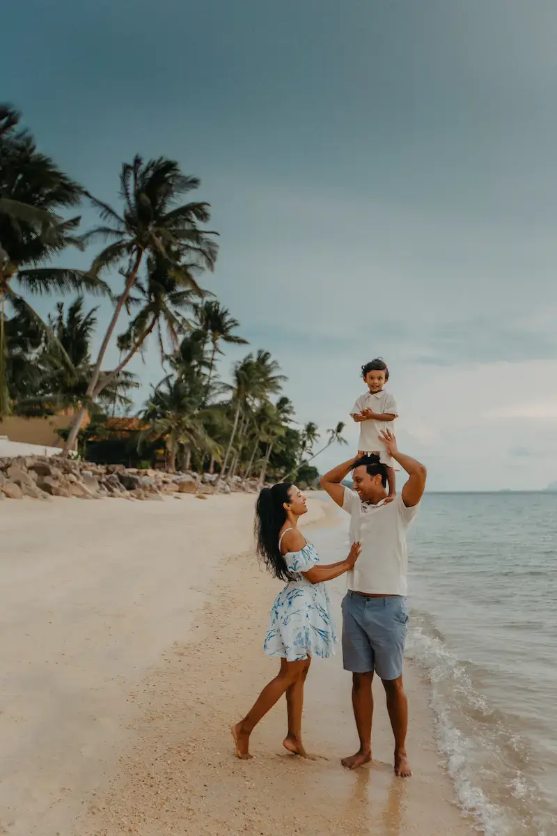 Professional family photographer capturing happy moments with a mother and child during a vacation in Koh Samui