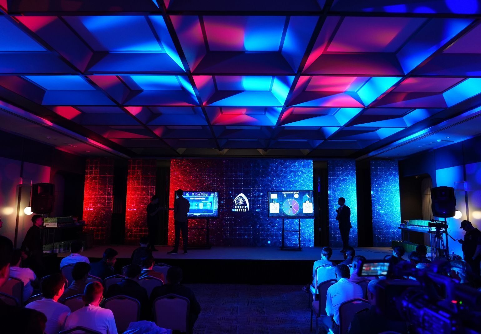 Conference stage with rgb lighting and presentation screens
